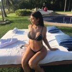 Kylie Jenner Thong Bikini Pool Candid Leaked Photos – Steamy Poolside Shots 13 kylie jenner thong bikini pool candid set leaked sbbscl